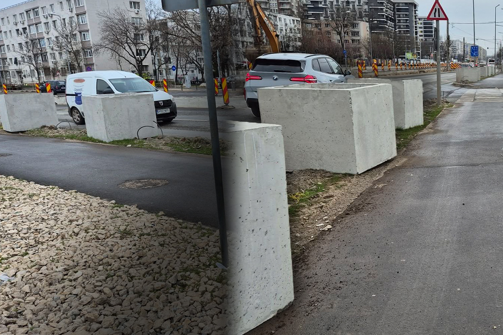 Blocuri de beton amplasate pe marginea trotuarului lângă o stradă urbană cu mașini și lucrări rutiere